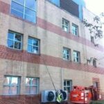 Using Height Access Equipment to Clean High Windows