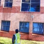 Cleaning High Windows With Water Fed Pole